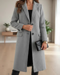 Grey long tailored notched lapel wool coat, front view