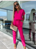 Women's belted wide-leg jumpsuit lightweight fabric front view | Alba Muse