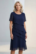 Women's ruffle midi dress with round neckline and sheer sleeves, front view