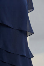 Women's ruffle midi dress, close up of layered ruffle detail