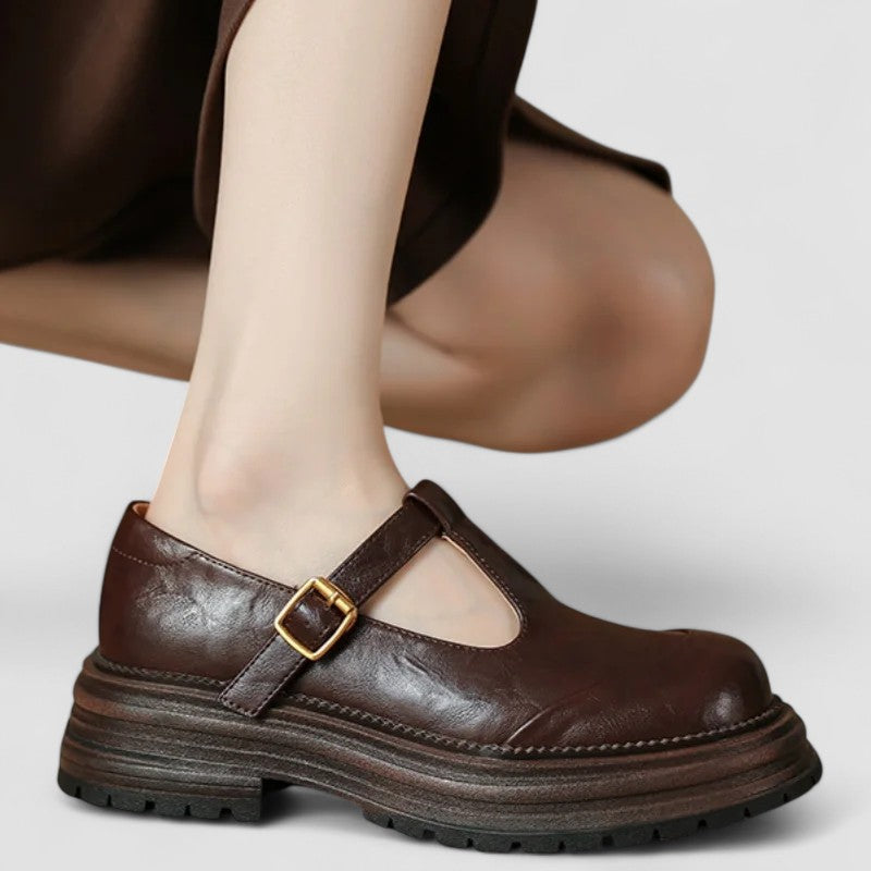Brown orthopaedic T strap buckle Mary Jane flats, front view