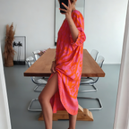 Wedding guest midi dress in vibrant hot pink and orange print, back view