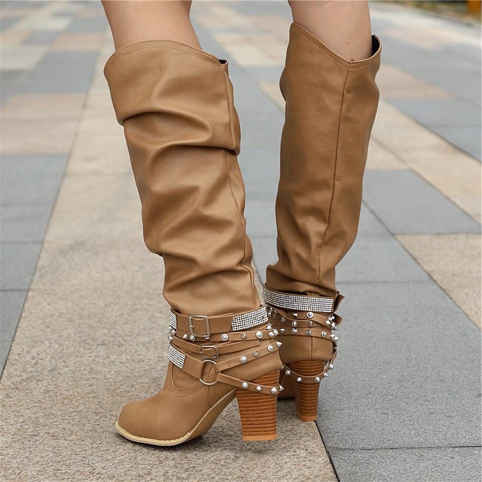 Slouchy studded block heel knee high boots with a knee high shaft