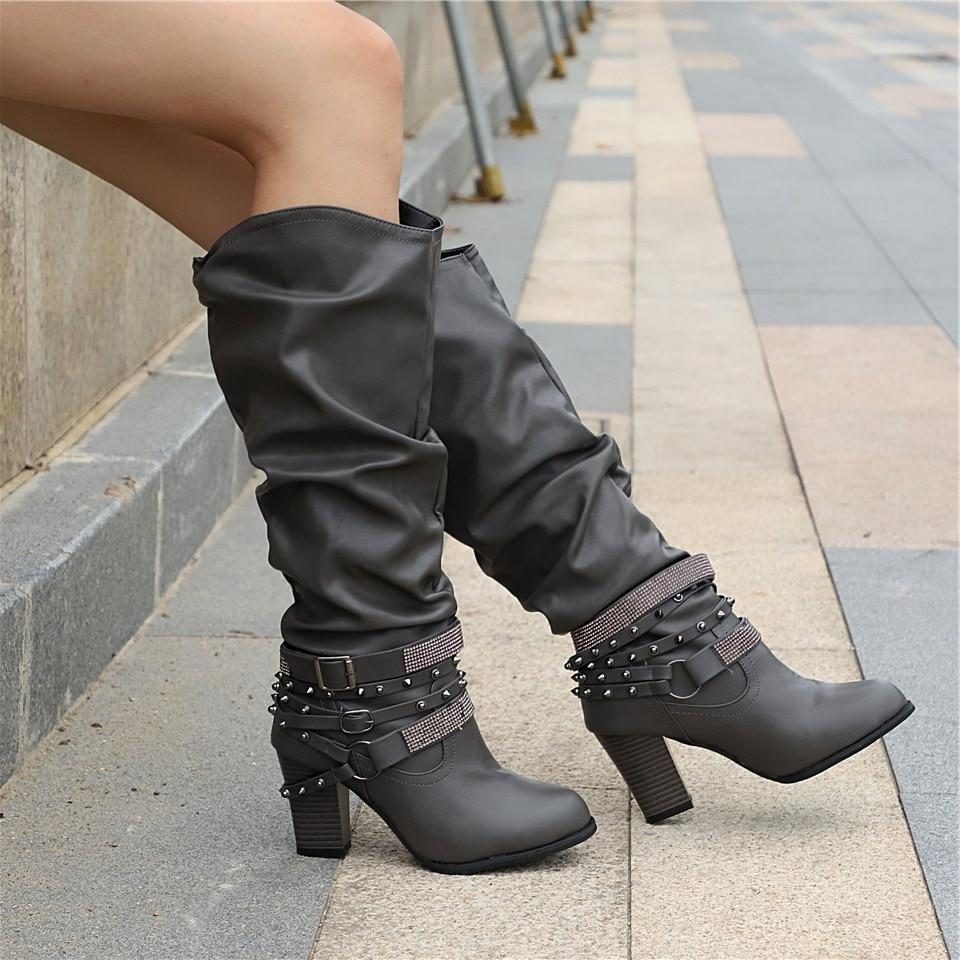 Slouchy studded block heel knee high boots with a slouchy gathered leg