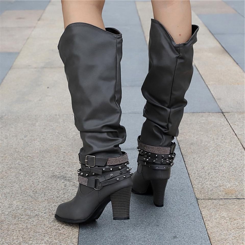 Slouchy studded block heel knee high boots with studded ankle straps