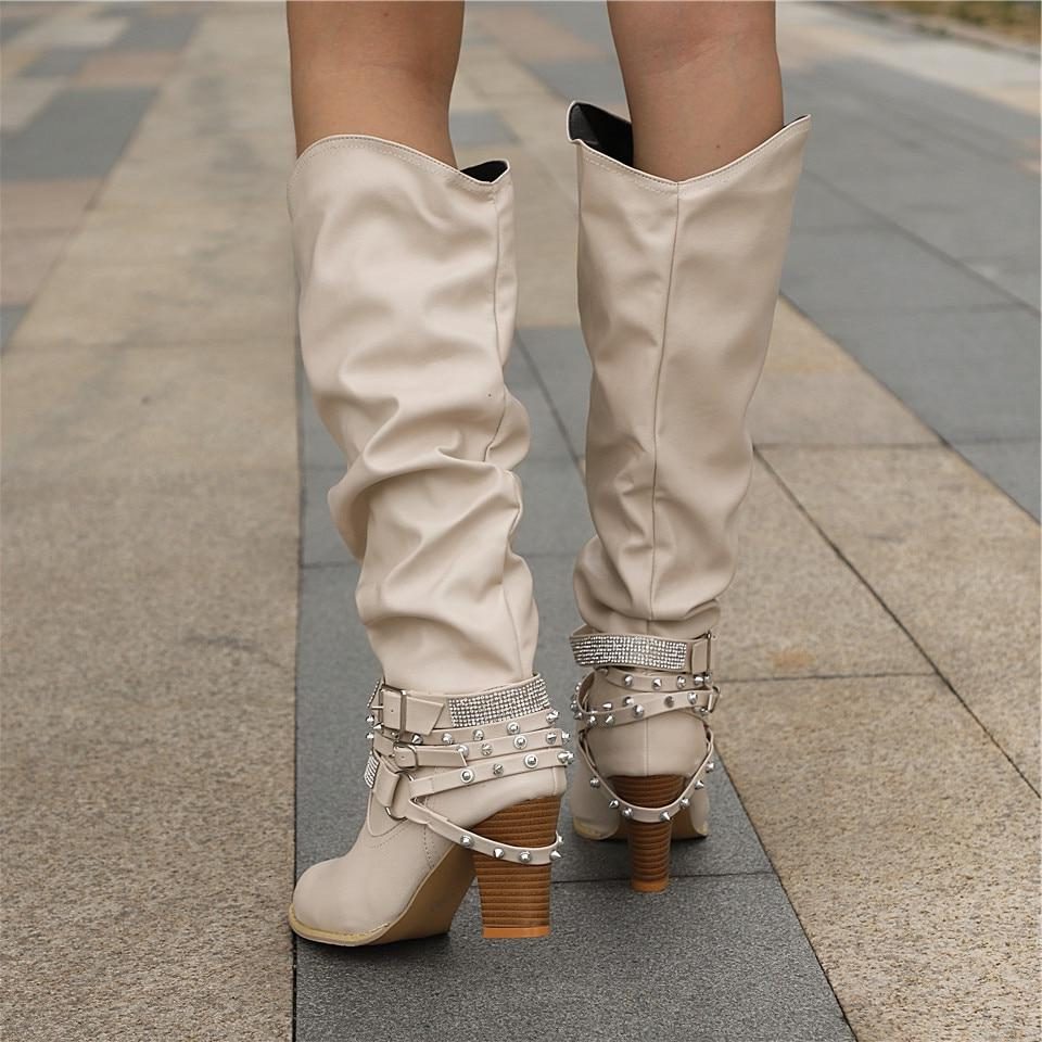 Slouchy studded block heel knee high boots with a slouchy gathered leg