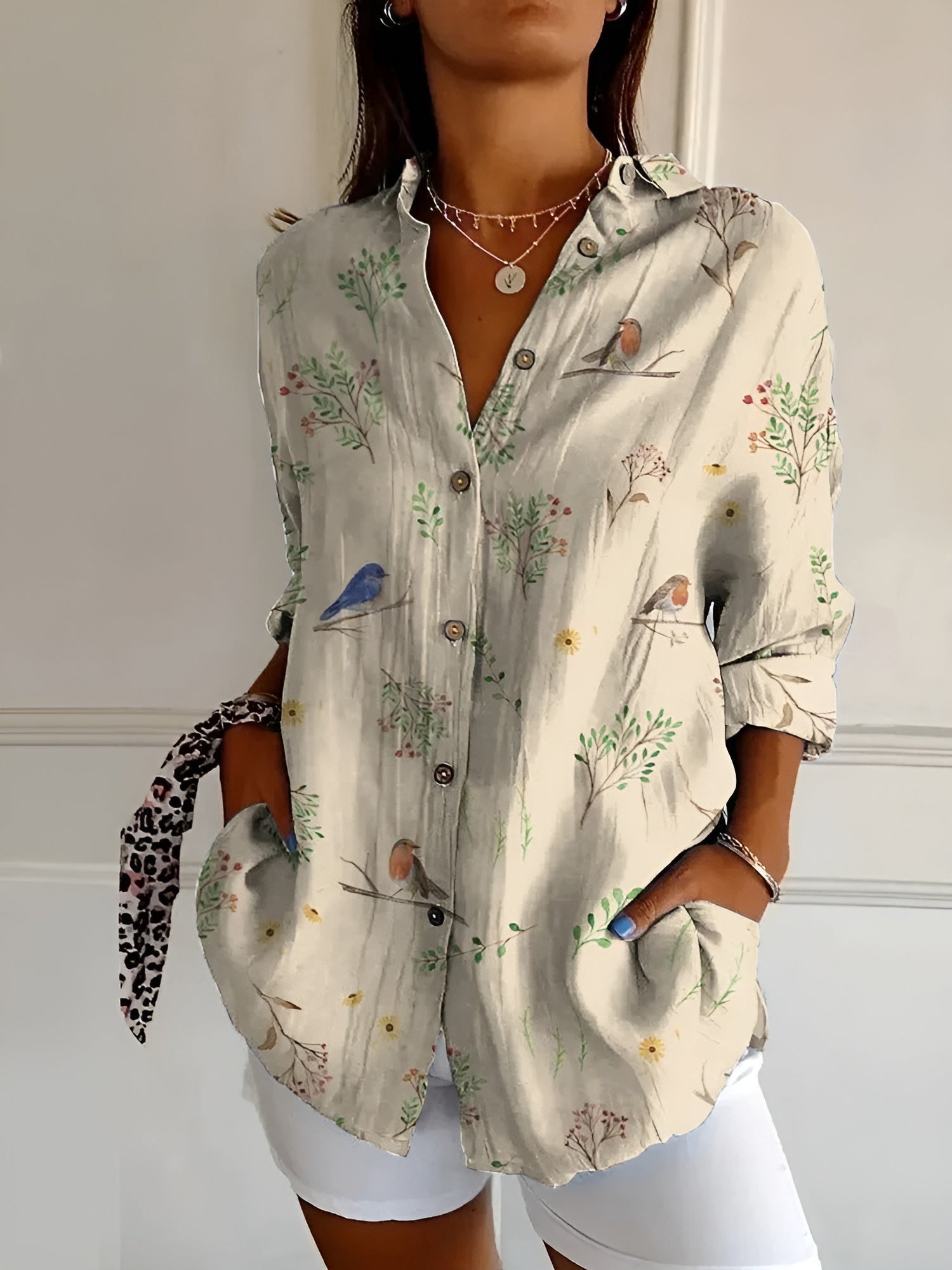 Close-up of floral print detail on women's lightweight blouse