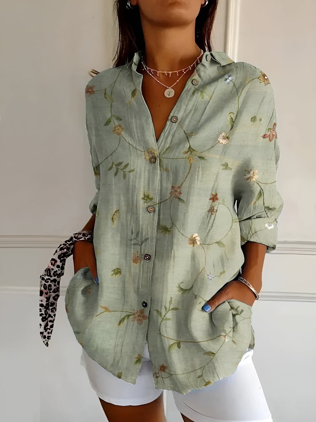 Front view of women's whimsical print floral blouse
