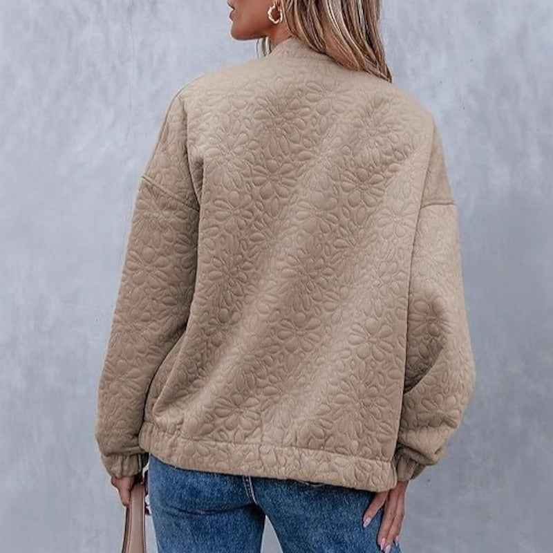 Khaki floral quilted bomber jacket, back view showing textured pattern