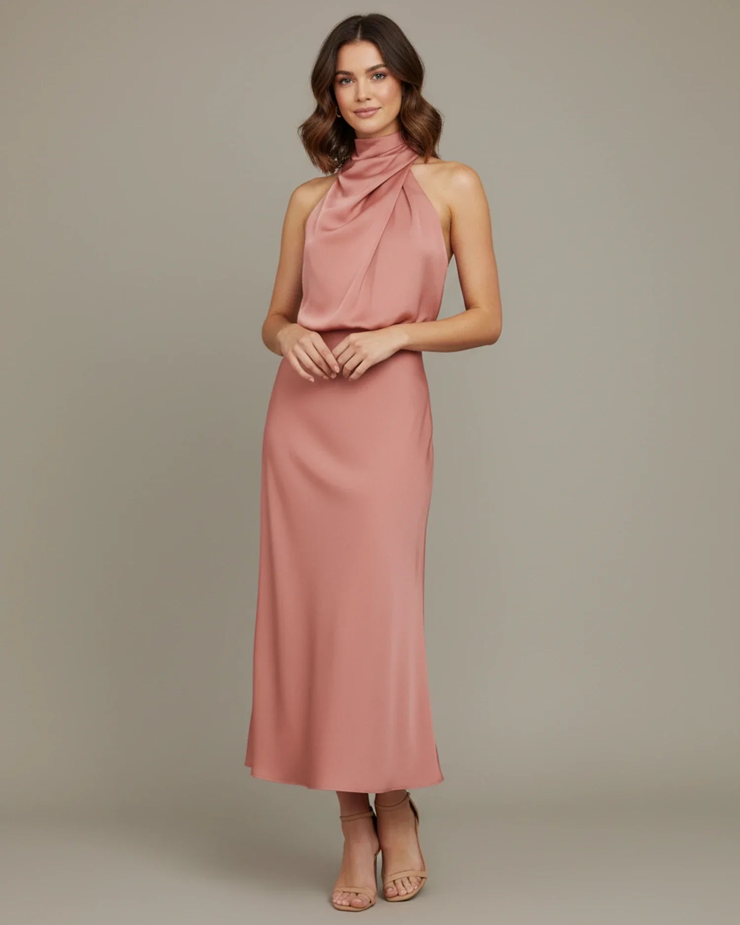 Women's halter cowl neck slip midi dress, styled for a formal event