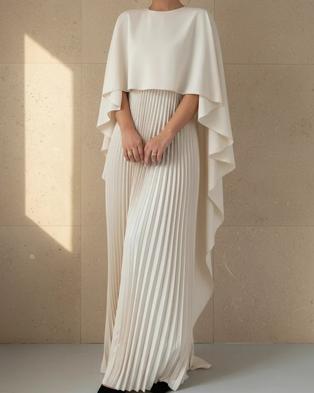 Women's pleated cape maxi dress, side view