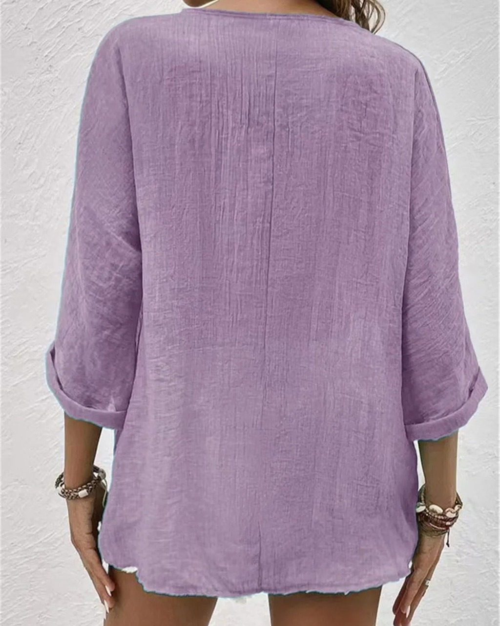 Deep V-neck button-down blouse in sage green, front view
