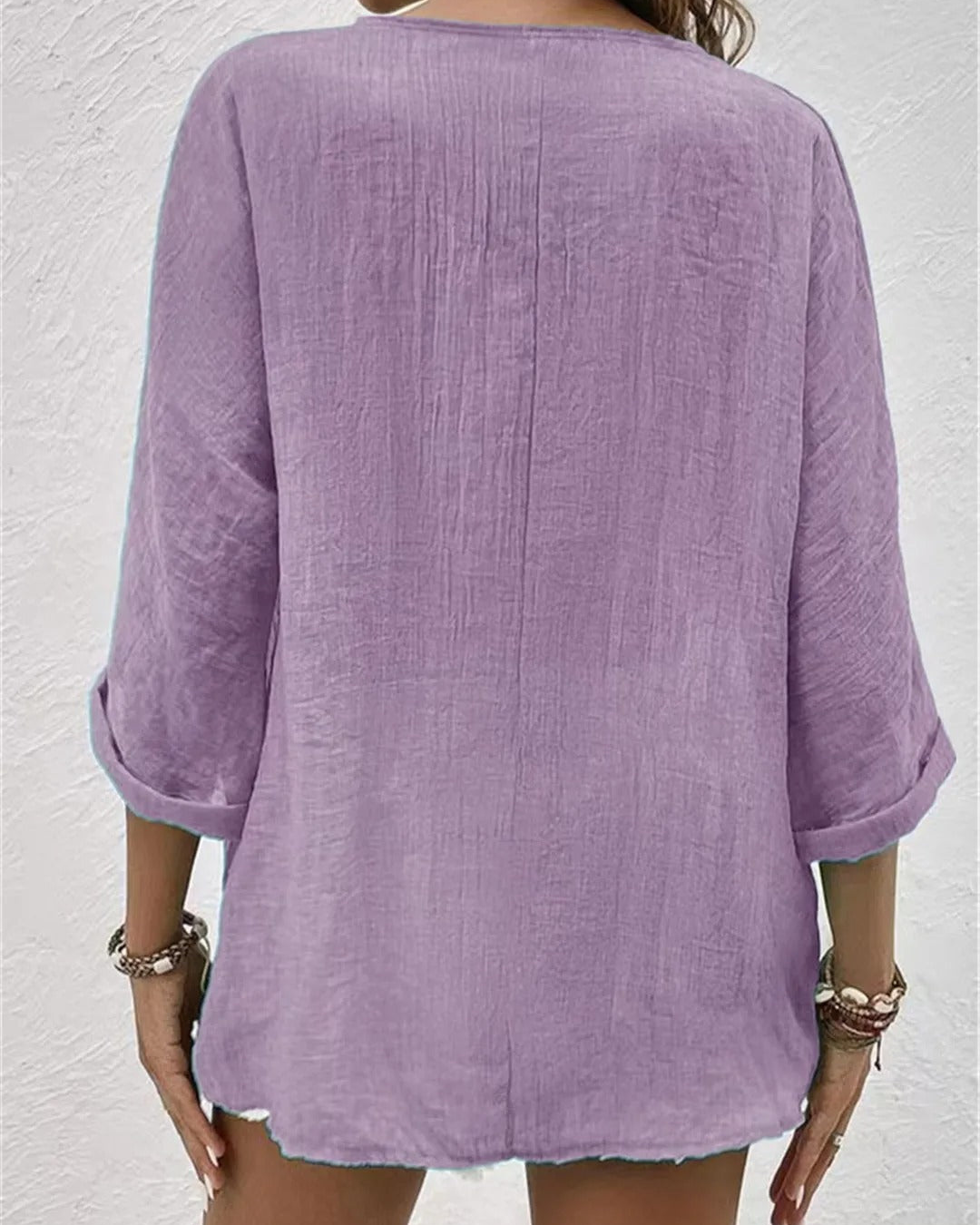 Deep V-neck button-down blouse in sage green, front view