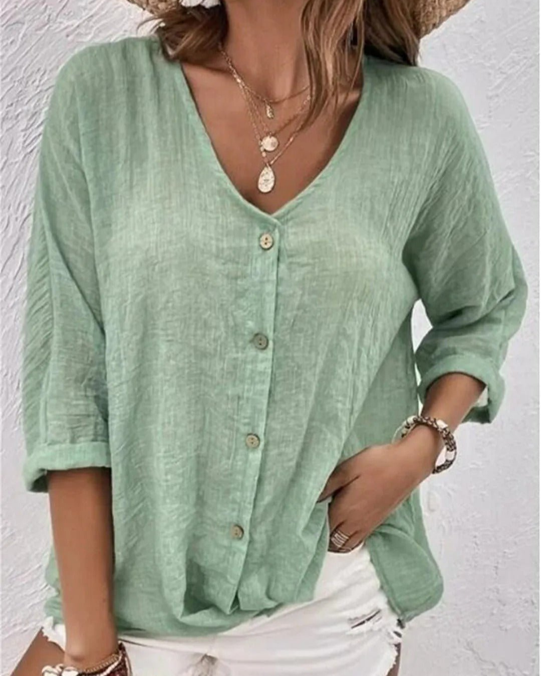 Deep V-neck button-down blouse in grey, front view