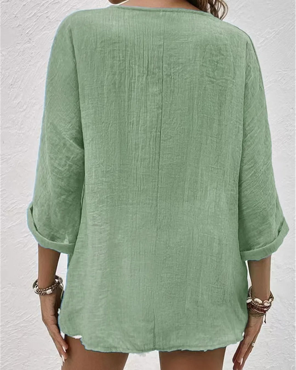 Deep V-neck button-down blouse in light brown, front view