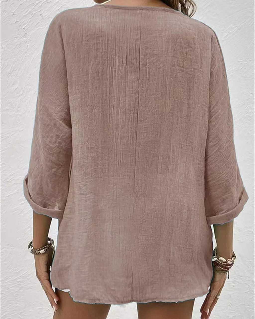 Deep V-neck button-down blouse, rolled sleeve detail