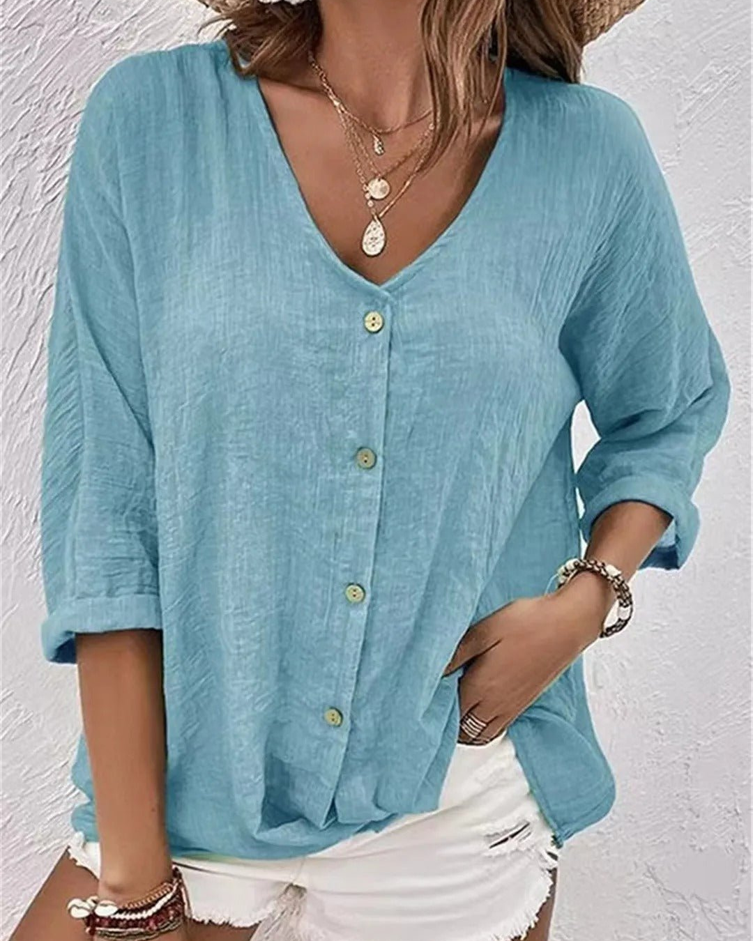 Deep V-neck button-down blouse, side view