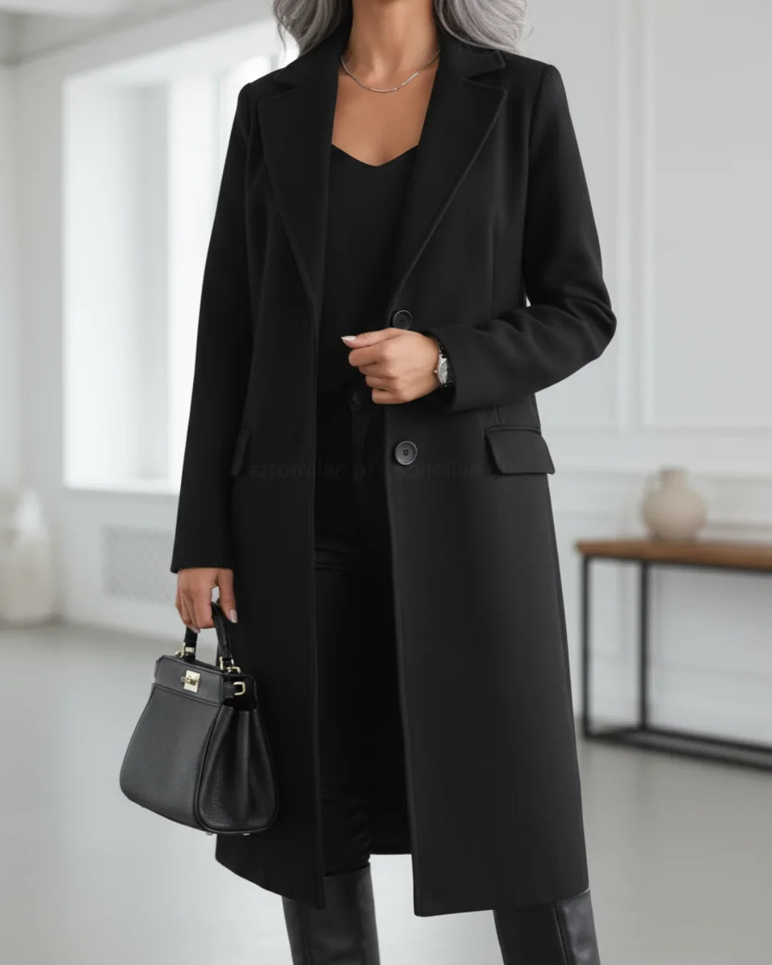 Long tailored notched lapel wool coat with a sleek insulating cut in Black