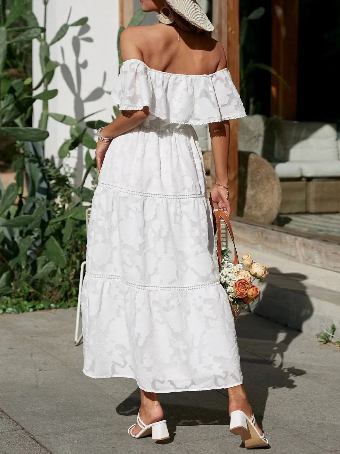 Side view of women's off shoulder tiered maxi dress