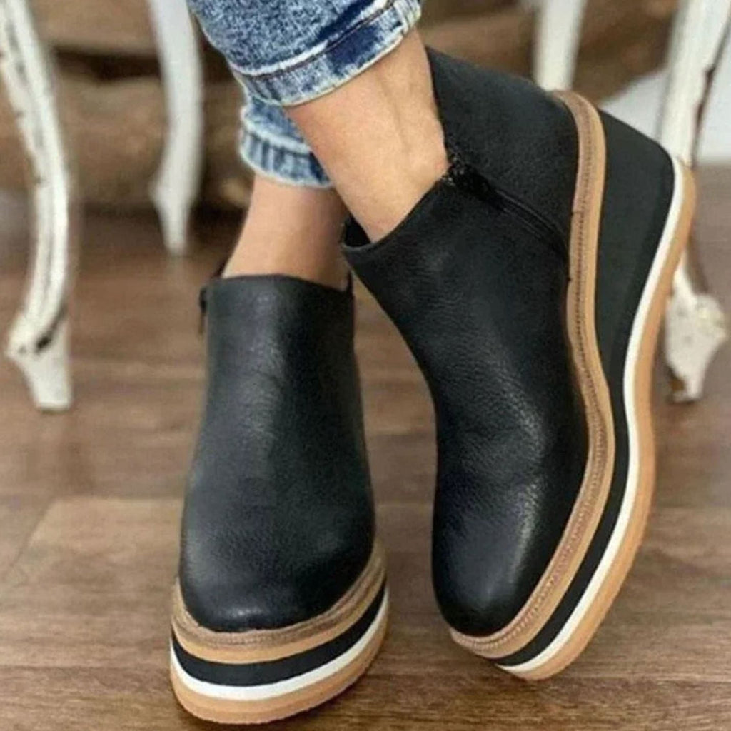 Platform wedge Chelsea ankle boots with a faux leather upper